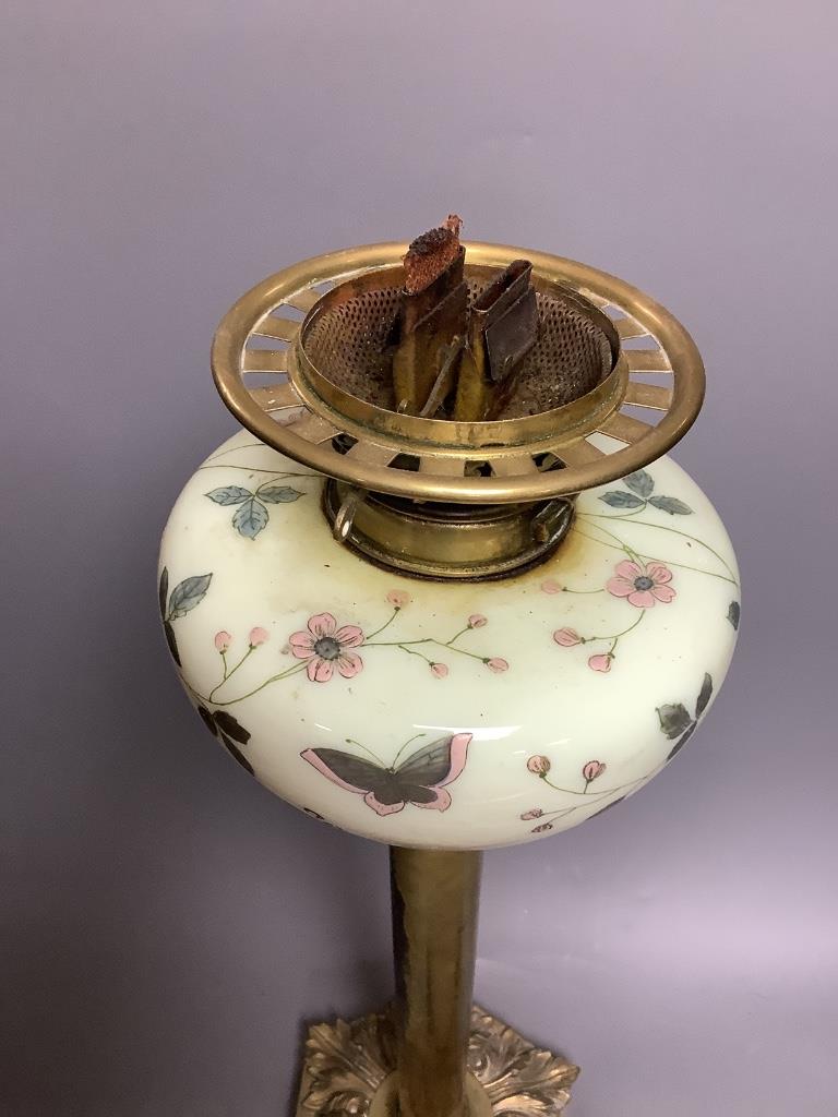 A Victorian brass and ceramic oil lamp, overall height including shade 78cm